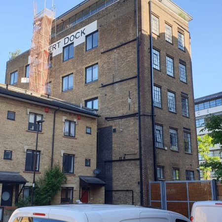 Albert dock refurb by abseiling, in centre of London. Includes roof replacement.